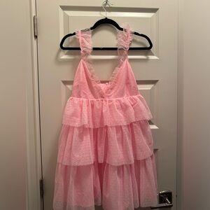A pink, ruffle, poofy dress! I wore thisfor my Glinda costume from WICKED